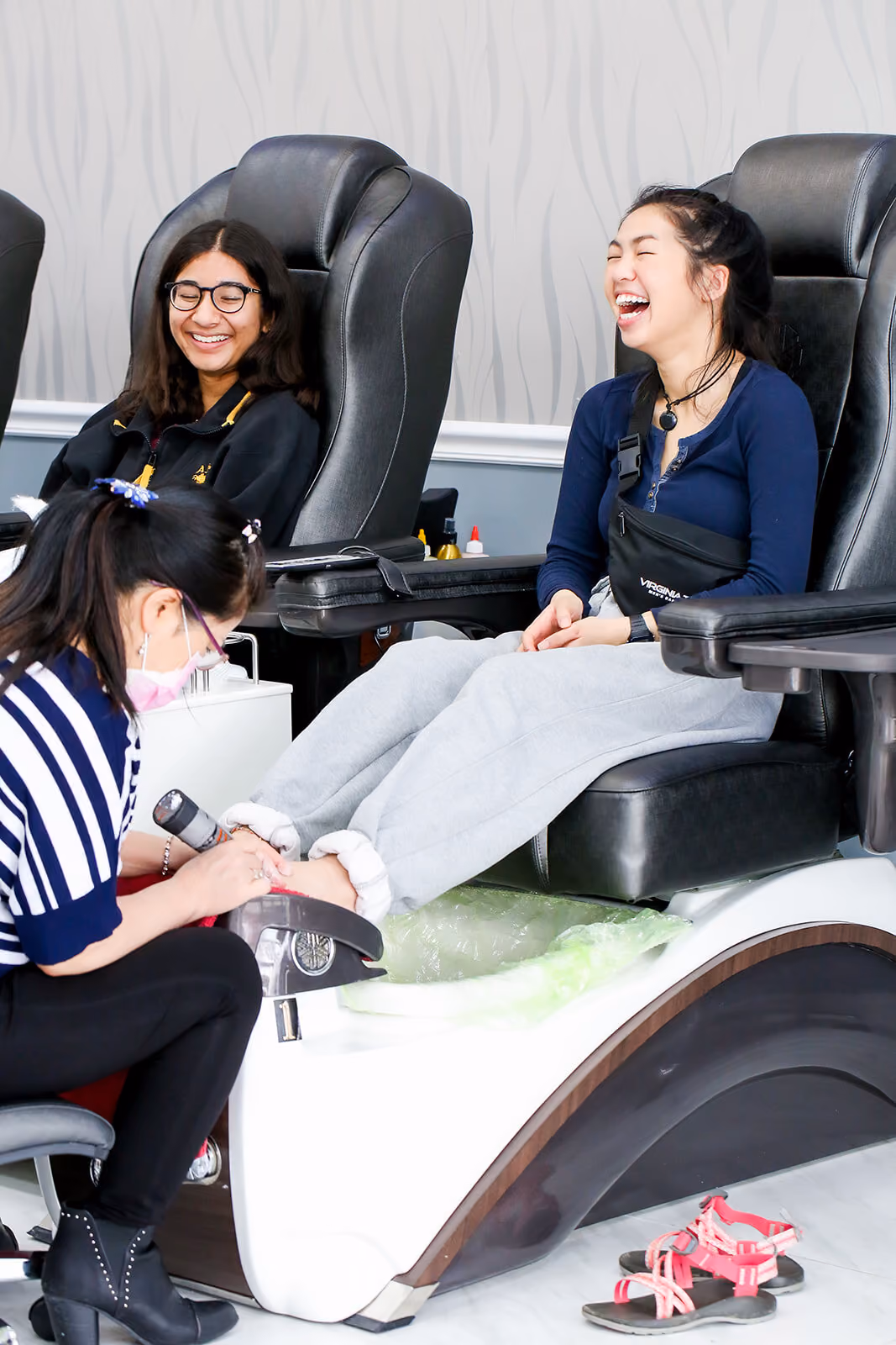 Two guests enjoying pedicures side by side at Crystal Nails Norfolk