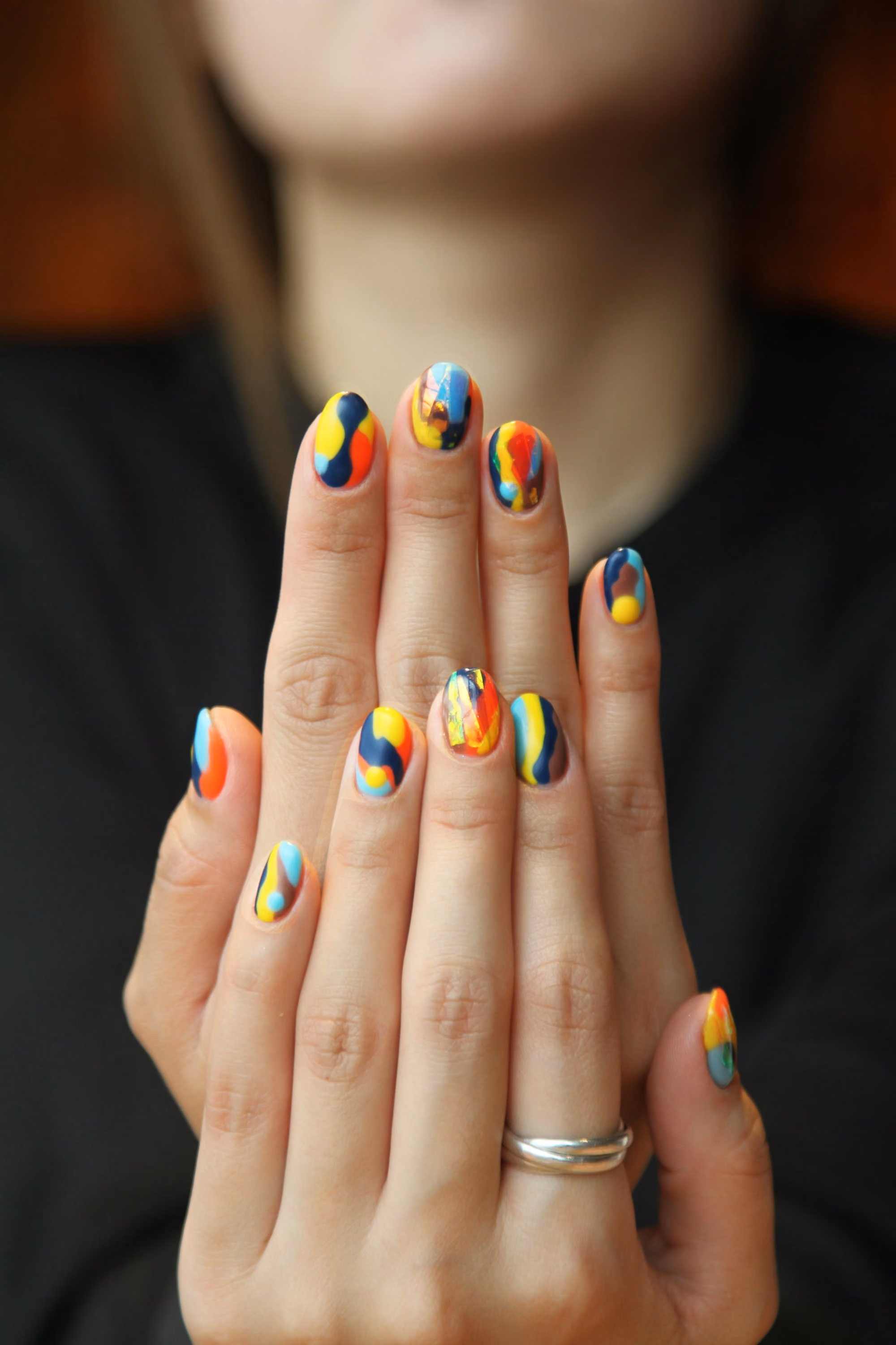 Colorful abstract nail art on natural nails