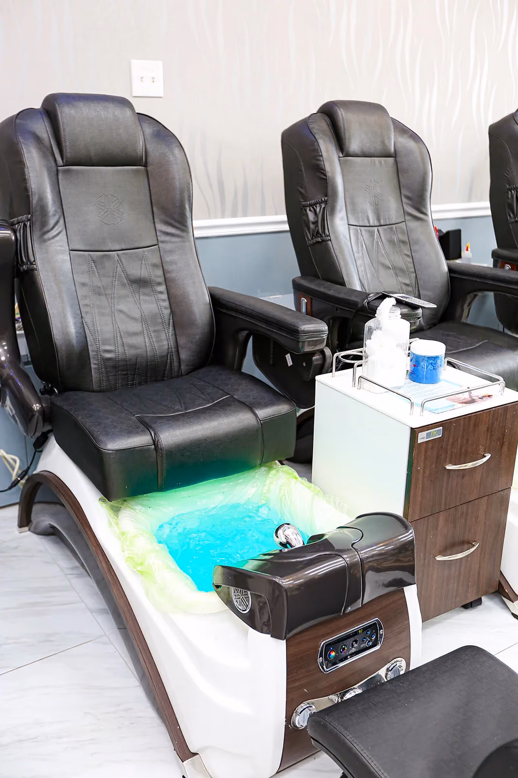 Pedicure chair with lit spa basin