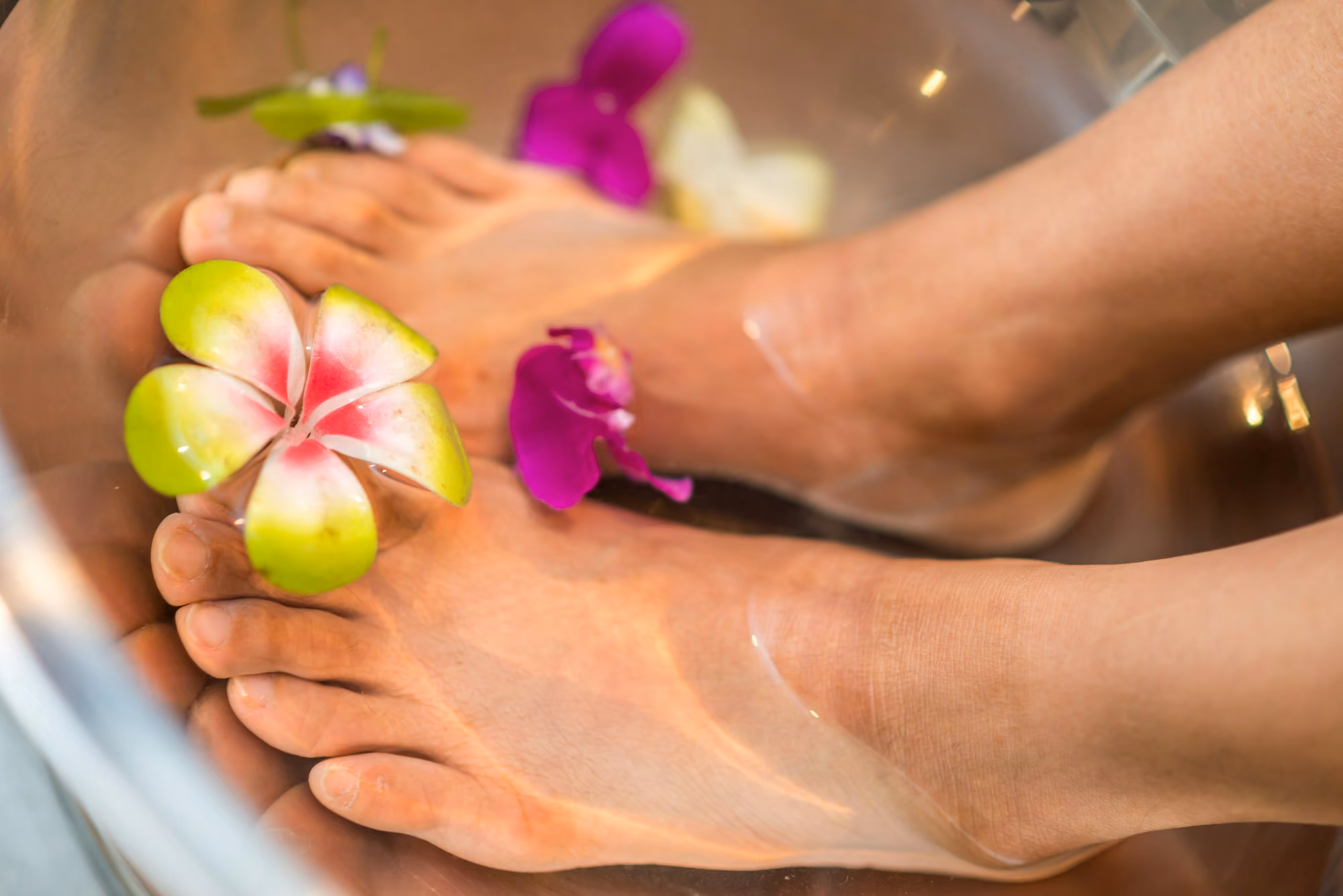 Pedicure soak with plumeria flowers