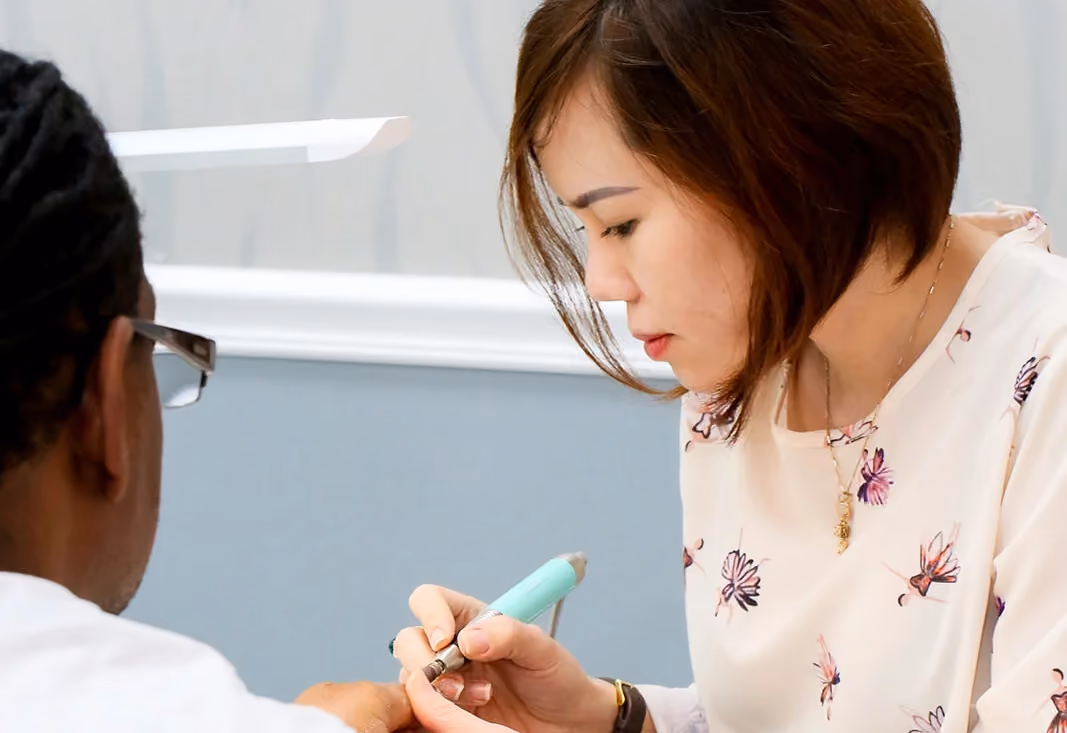 Crystal Nails technician giving a precise manicure